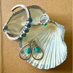 Turquoise and silver bracelet with earrings and ring.